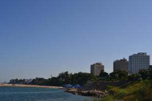 a body of water with buildings in the background at Casa Tatiana Eforie Nord in Eforie Nord