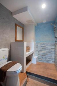 a bathroom with a toilet and a shower at P1 House in Sathani Phitsanulok