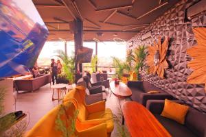 a restaurant with a bunch of chairs and tables at Beautiful Penthouse w/ incredible views, pool, & cinema room! in Canggu