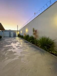 a swimming pool in the backyard of a house at Casa, 01 Suíte, Ar-Cond, Área Gourmet e Garagem Ampla in Montes Claros