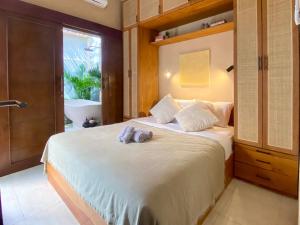 Postel nebo postele na pokoji v ubytování Paradise Haven in Nusa Dua + 20 fotografií