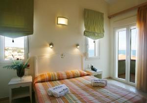 A bed or beds in a room at Sea View Resorts & Spa