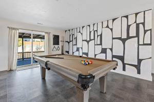 a pool table in a room with a wall at Polar Express Hot Tub Pool Table Mountain Views in Williams