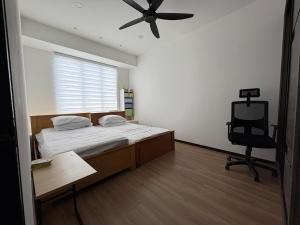 Postel nebo postele na pokoji v ubytování Matang Jaya Kuching Homestay