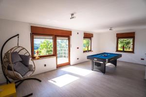 a room with a ping pong table at Casa Kavran in ŽeljezničkaStanica )) (( Skrad