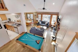 an overhead view of a living room with a pool table at Whispering Pines Hot Tub, Porch & Waterparks in Tannersville