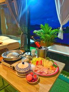 a table with a tray of food on it at One dayภูทับเบิก in Ban Maeo Thap Boek