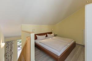 Un pat sau paturi într-o cameră la Schneeeule 207 +19 fotografii