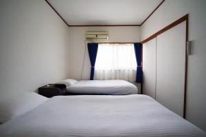 Postel nebo postele na pokoji v ubytování Guest House WASSO
