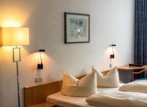 Postel nebo postele na pokoji v ubytování Median Hotel Garni