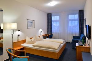 Postel nebo postele na pokoji v ubytování Median Hotel Garni