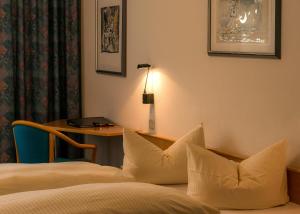 Postel nebo postele na pokoji v ubytování Median Hotel Garni