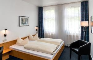 Postel nebo postele na pokoji v ubytování Median Hotel Garni