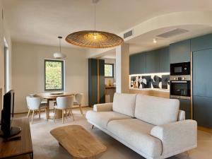 a living room with a couch and a table at Casa Levante in Porto Santo Stefano