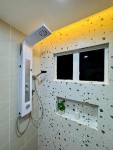a bathroom with a shower with a window at Afamosa Sunset Villa 22pax Snooker BBQ KTV New in Kampong Ulu Pegoh