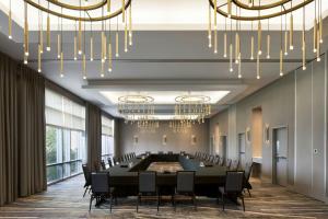 a conference room with a large table and chairs at Courtyard by Marriott Montreal Airport in Dorval +45 photos