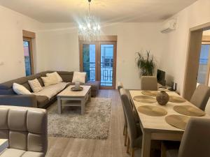 a living room with a couch and a table at The Coastal Charm - Summer Season Recommendation in Pržno