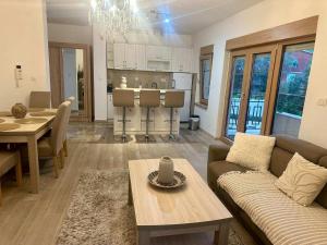 a living room with a couch and a table at The Coastal Charm - Summer Season Recommendation in Pržno
