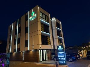 een kantoorgebouw met een bord ervoor bij Hotel Spa Olive in Mostar