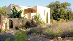 a house with a garden in front of it at Toile Blanche in Saint Paul de Vence