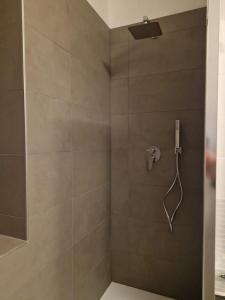 a shower with a shower head in a bathroom at Garda Smile in Riva del Garda