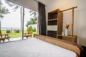 Ένα ή περισσότερα κρεβάτια σε δωμάτιο στο Moi Induruwa by DBI +61 φωτογραφίες