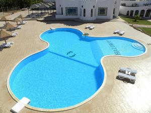 a large swimming pool in front of a building at Grand Halomy Megan in Sharm El Sheikh +97 photos