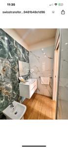 a bathroom with a sink and a toilet at Villa Perla Del Mare in Mondragone +48 photos