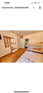a bedroom with a bunk bed in a room at Villa Perla Del Mare in Mondragone
