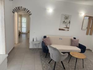 a living room with a couch and a table at Deda Apartments in Livadia