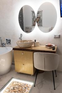 a bathroom with two sinks and a mirror at My Hersonissos Home Brand New Luxury apt in Limín Khersonísou
