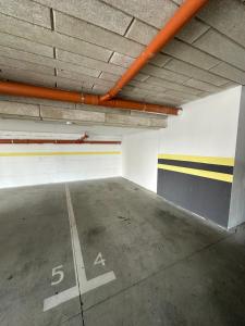 an empty parking garage with a parking space at Donath Accomodation in Floreşti