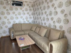 a living room with a couch and a table at Astara Terrace 2-34 in Astara