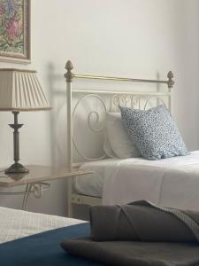 En eller flere senge i et værelse på Casa da Oliveira