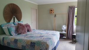 a bedroom with a bed with two teddy bears on it at Spacious on Sarita in Cromwell