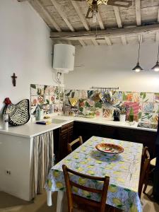 a kitchen with a table with a plate on it at Casa Oliva Casperia, house & private olive grove in Casperia