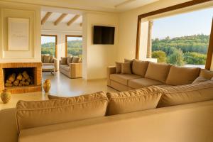 a living room with a couch and a fireplace at Villa Jasmin 12 in M'diq