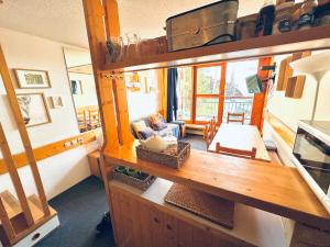 a view of a kitchen and a living room at Duplex arcs 1800 aux pieds des pistes in Arc 1800