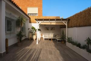 an outdoor patio with a pavilion with a roof at La Brisca Sun & Soul Pedregalejo in Málaga