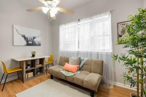 a living room with a couch and a table at Design-led 1br In Prime Spot in Philadelphia