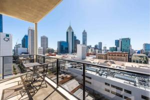 a balcony with a view of a city skyline at Barrack Street City Pad 2br 2 Bth in Perth