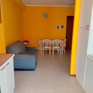 a room with a bed and a table and chairs at Casa Zàgará in Schisò +9 photos