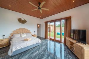 Кровать или кровати в номере Villa Soleil Lembongan +19 фотографий