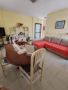 a living room with a table and a couch at House Rural,Biosphere Reserve World.Taganana.Tfe. in Santa Cruz de Tenerife