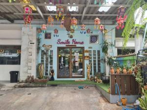 a smile time store with a sign in front of it at Double Studio with Balcony & Private Bath by Smile Loft in Ban Na Song