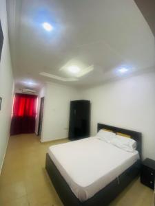 Ένα ή περισσότερα κρεβάτια σε δωμάτιο στο Tiffy Apartment