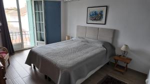 En eller flere senge i et værelse på Le Gabian, duplex proche plage et centre