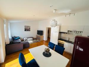 a kitchen and a living room with a table and chairs at Apartment Novigrad Holiday in Novigrad Dalmatia