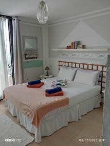 a bedroom with a bed with two pillows on it at casa Emilia Cotillo Mar in Cotillo