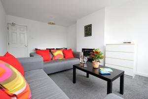 a living room with a couch and a table at Ideal Bath House by St James’s Park in Bath